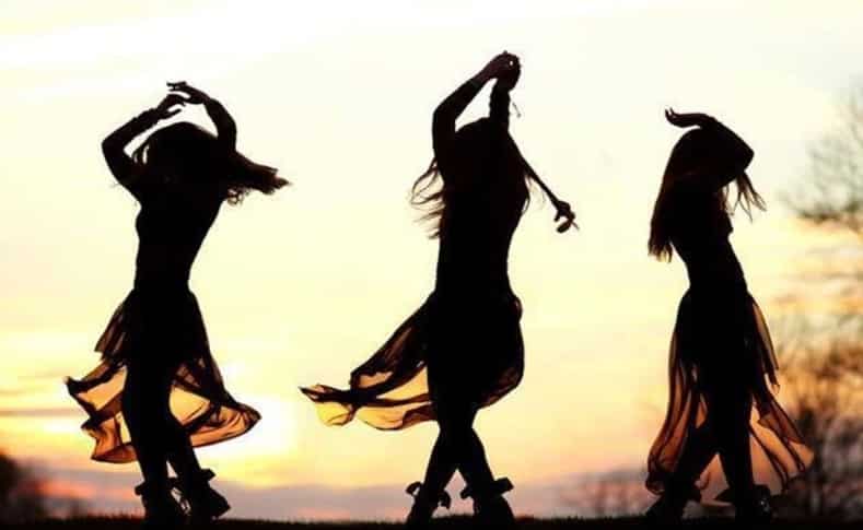 three women dancing meditation